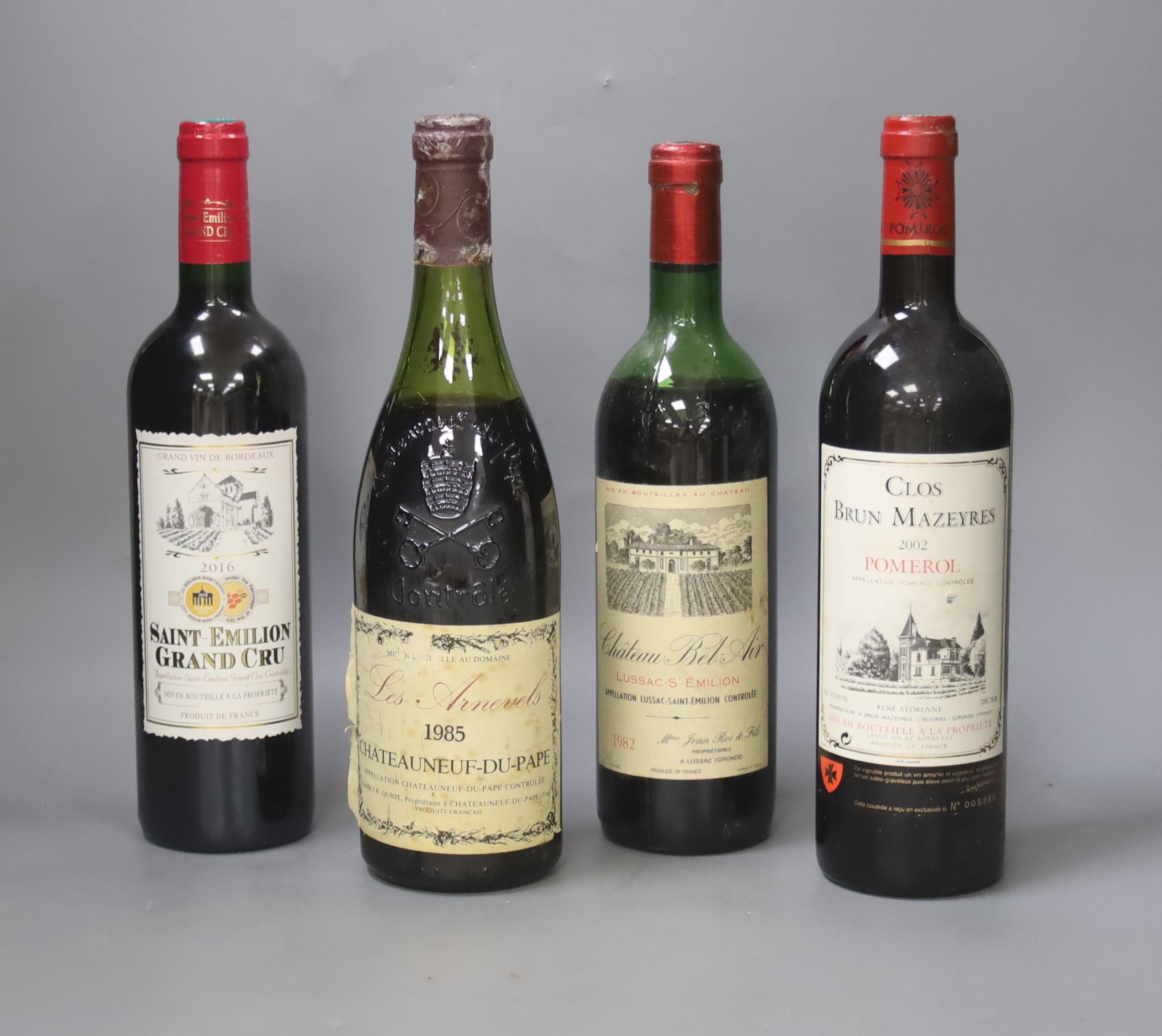 4 bottles of red wine - Chateau Neuf du Pape 1985, Pomerol 2002, Saint-Emillion grand cru 2016, Chateau Bel-Air 1982